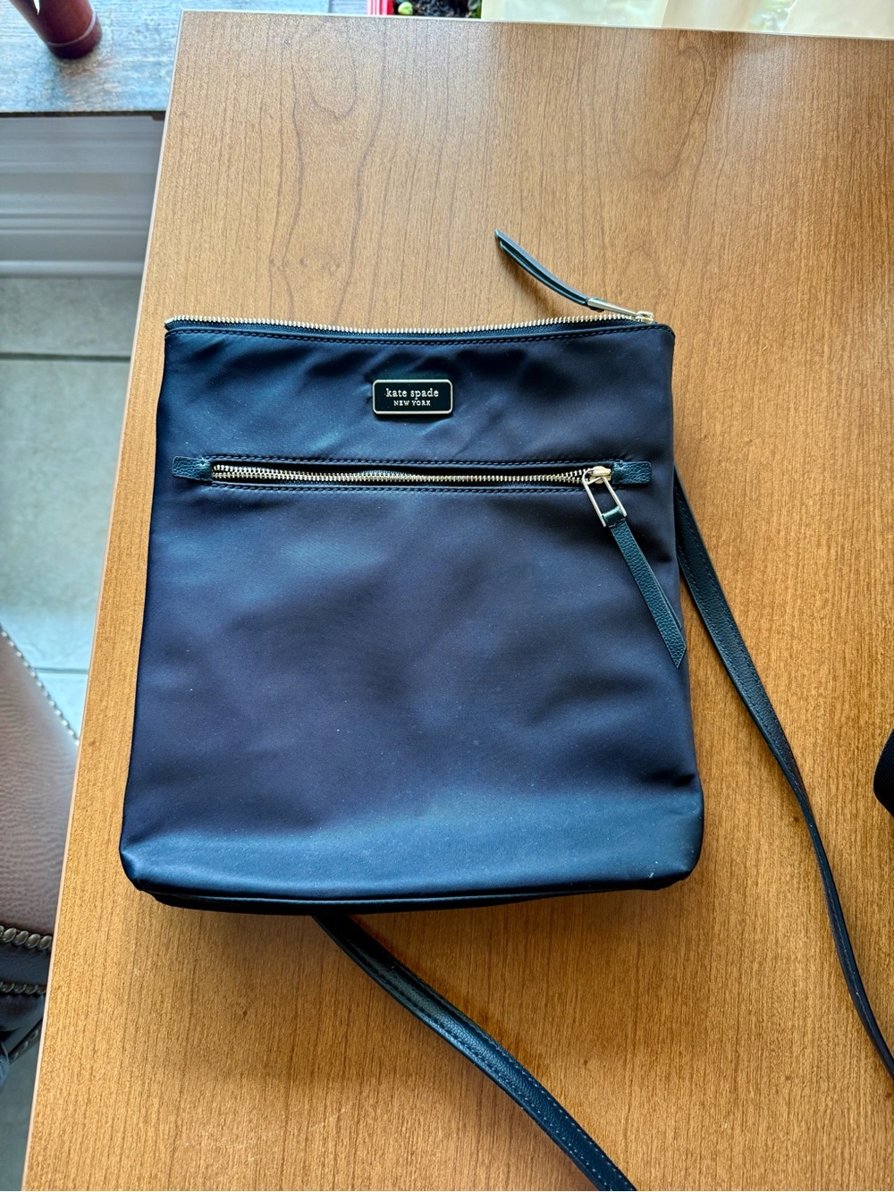 Kate Spade black crossbody bag with gold hardware